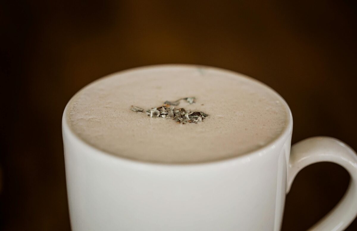 chai lactation latte: A delectable creamy beverage in a white mug, perfect for a warm drink.